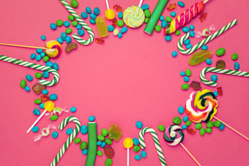 Obraz na płótnie Canvas Frame of colorful bright assorted candy