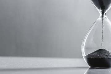 Close up hourglass on table