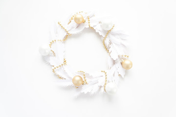 Christmas wreath made of white paper on white background