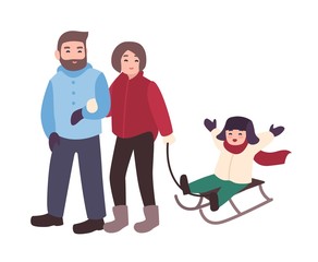 Parents drawing sled with their son