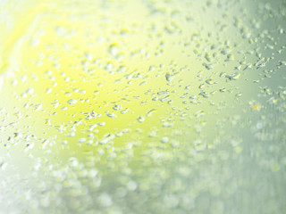 abstract image: waterdrops after snowfall at the car window driverS´side. Shallow depth of field