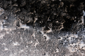 Texture of ice on baikal lake in winter. Cracked ice texture.