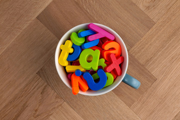 Plastic lettering in a mug