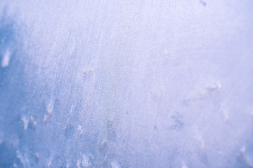 Frosty christmas pattern at a winter window glass