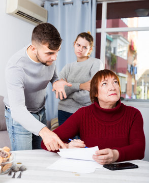Adult children controlling elderly mother signing of documents