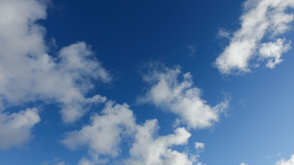 Clouds on a blue sky in cold winter day