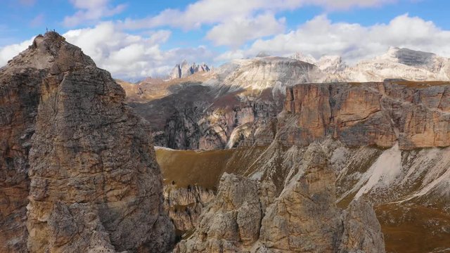 Aerial view of the Paso Gardena Pass in the province of Bolzano. Dolomites. Flying near the Pizes de Cir. In the distant view of a mountain Schelrn. Autumn in Italy