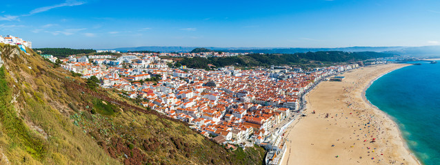 From the high point of the Nazare we can see the beach the sea and the village Nazare, Portugal