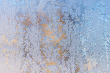 Frosty christmas pattern at a winter window glass