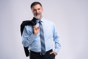 Happy satisfied mature businessman looking at camera isolated on white background.