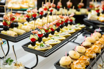 different types of catering canapes on buffet