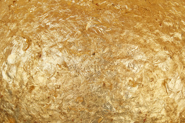 Shiny yellow leaf gold foil texture background
