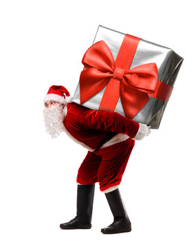 Santa Claus with giant Christmas present or New Year gift box isolated on white background