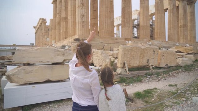 Family near ancient Parthenon in the Athenian Acropolis.