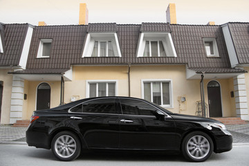 Car on the background of a private house