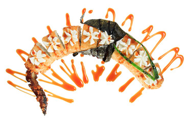 Hot fried sushi rolls in the shape of a dragon. Isolated on white background. Creative dish on the menu.