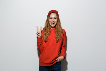 Portrait of a cheerful young woman wearing hoodie