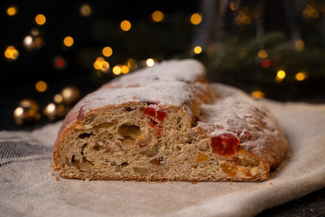 Traditional European Christmas pastry, fragrant home baked stollen, with spices and dried fruit.