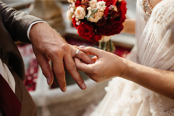 bride and groom holding hands