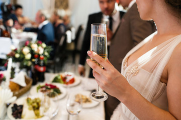 bride and groom with glasses of champagne