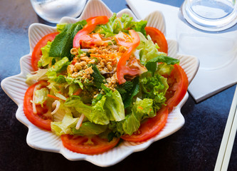 Chicken salad with greens and tomatoes