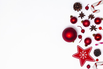 Christmas composition isolated on white background. Red glass balls and toys. New Year flat lay, top view.