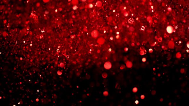 Red glitter explosion in super slow motion shooted with high speed cinema camera.