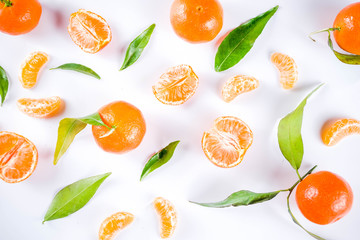 Fresh raw organic tangerines with leaves, top view flatlay copy space