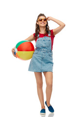 leisure, summer holidays and people concept - smiling teenage girl in sunglasses with beach ball over white background