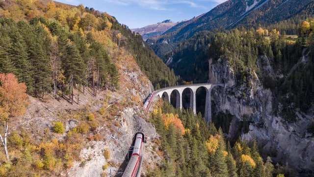 Following a train on the viaduct Landwasser in Swiss mountains during the autumn. Filmed with the DJI Inspire 2 drone in 5.2k RAW resolution and downscaled to 4k.