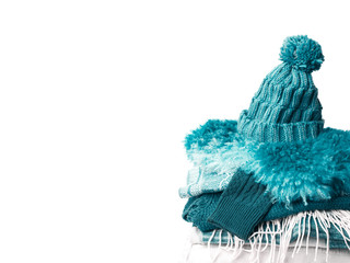 Pile of clothes on table on white