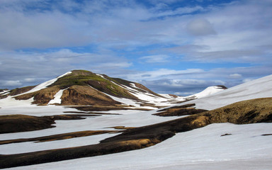 Multicolored rhyolite mountains in active geothermal area Jokultungur, Laugavegur trail, near...