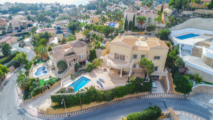 Fototapeta premium Big villa with swimming pool situated on sea side drone shoot 