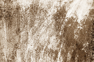 Сraked weathered cement wall texture in brown tone.