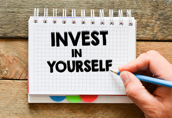 Invest in yourself text concept