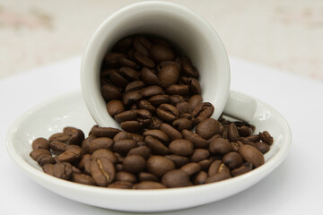 top view cup with coffee seeds and beans isolated on white backgorund. tasty morning drinks and beverages.