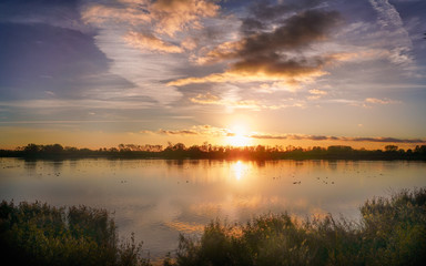 Fototapeta na wymiar Sunset over the lake 