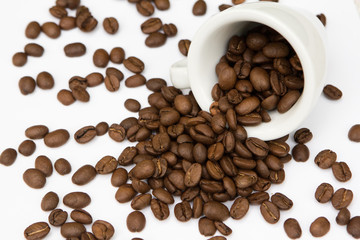 top view cup with coffee seeds and beans isolated on white backgorund. tasty morning drinks and beverages.