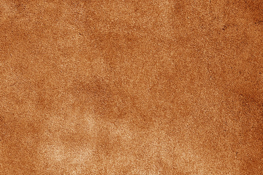 Natural leather surface in orange tone.