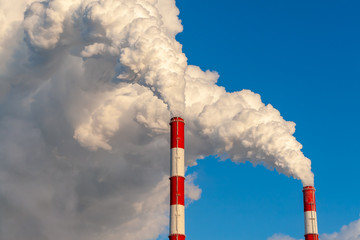 Pipes of thermal power plants on a frosty winter day, close-up.