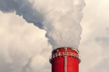 The top of a giant chimney, close-up. Smoke from the chimney, close-up