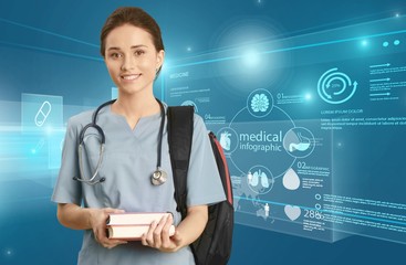 Attractive young female doctor student on background