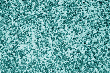 Pile of small gravel stones in cyan tone.