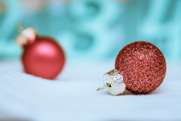 Red Christmas balls with decoration on shiny background
