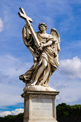 Fototapeta na wymiar Angel with Cross, statue from the Sant'Angelo Bridge in Rome, Italy