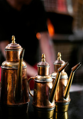 Fototapeta na wymiar olive oil copper cruet traditional dispenser detail in italian restaurant
