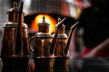 olive oil copper cruet traditional dispenser detail in italian restaurant