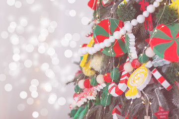 Christmas background with decorated Christmas tree. New year card. Vintage effect.
