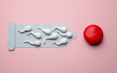 Spermatozoa in the condom and the cell, preventing fertilization. Contraceptives against pregnancy, safe sex from genital tract