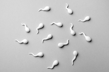 Group of sperm on gray background